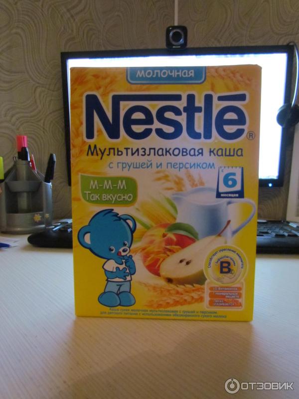 Мультизлаковая каша с грушей и персиком Nestle фото